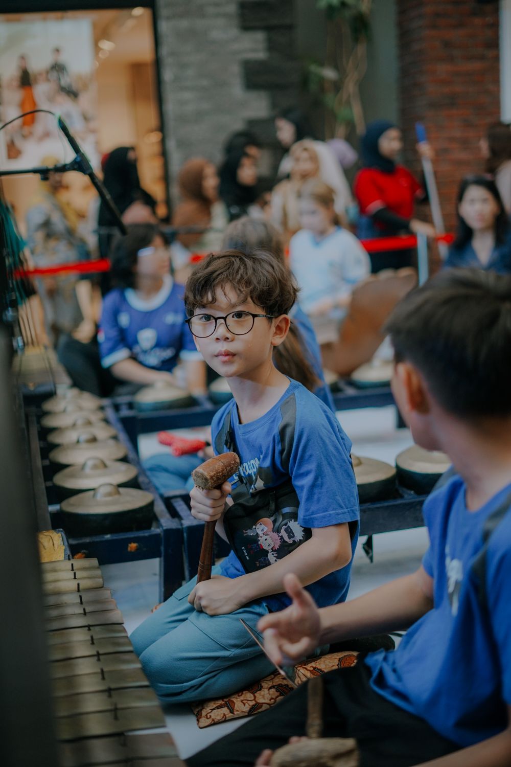 Children learning music together in class